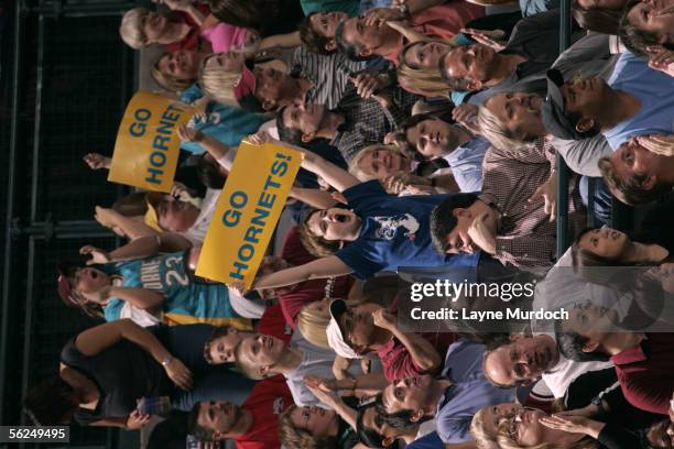 Fans of the New Orleans/Oklahoma City Hornets hold up signs that read "Go Hornets" in support of their team against the Dallas Mavericks November 12,...