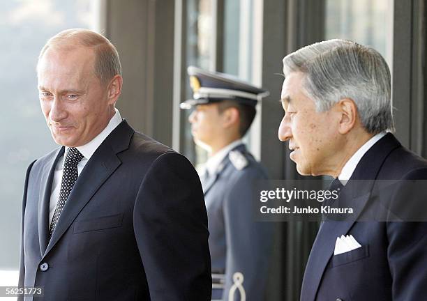 Russian President Vladimir Putin is led by Japanese Emperor Akihito upon his departure at the Imperial Palace on November 22, 2005 in Tokyo, Japan....