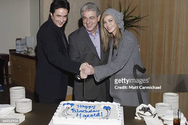 Actor John Cusack, Director Harold Ramis and actress Connie Nielsen cut a cake in honor of Ramis' birthday during the after party for the Focus...