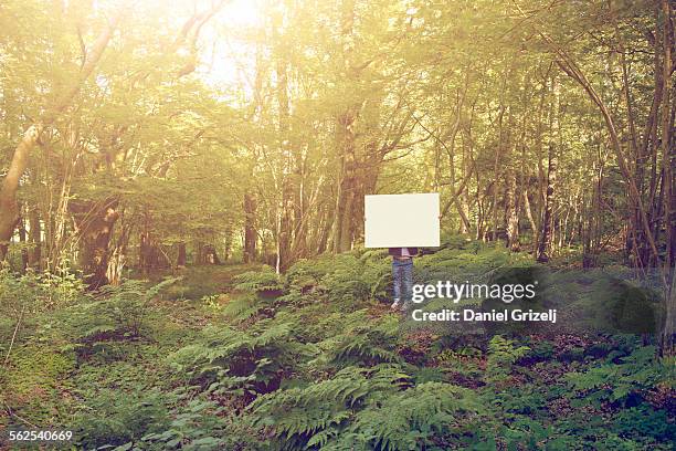 blank sign - holding a sign stock-fotos und bilder