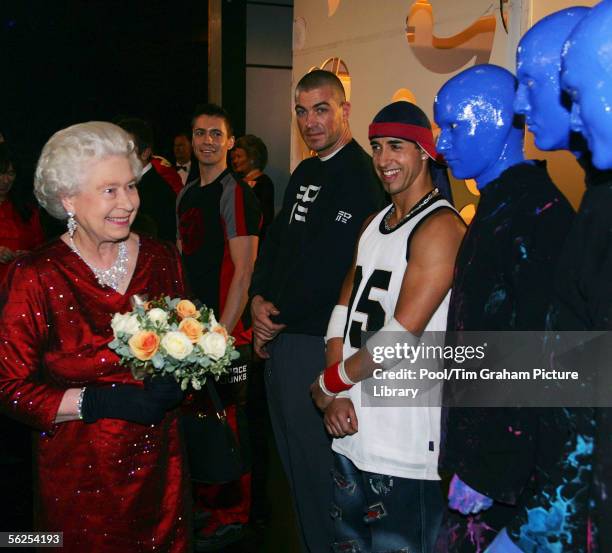 Queen Elizabeth II meets the Blue Man Group backstage following the Royal Variety Performance, November 21, 2005 in Cardiff, Wales.