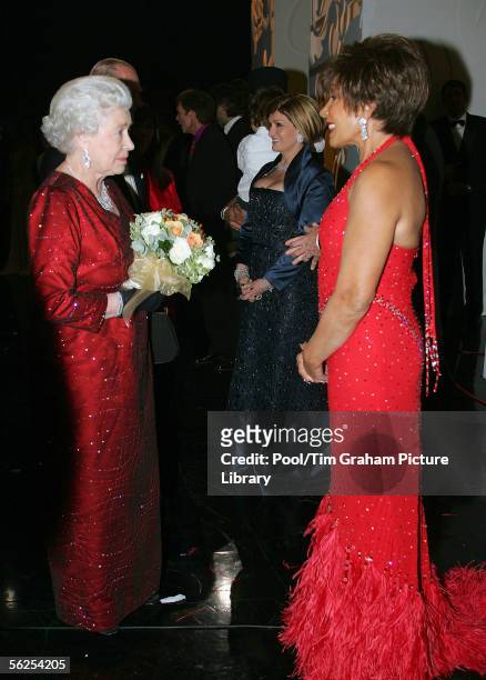 Queen Elizabeth II meets singer Dame Shirley Bassey backstage following the Royal Variety Performance, November 21, 2005 in Cardiff, Wales.