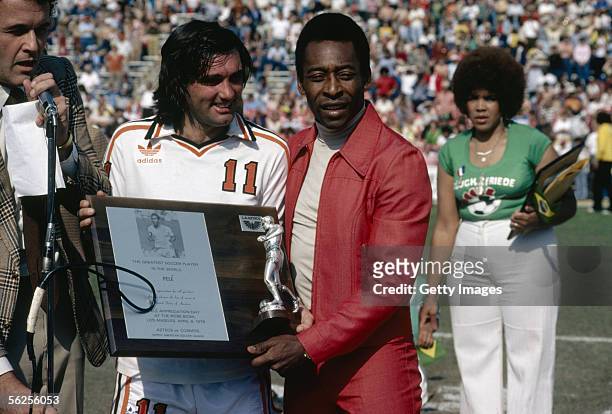 George Best presents Pele with a plaque commemorating the Brazilian as the best soccer player in the world during Pele Appreciation Day at Rose Bowl...