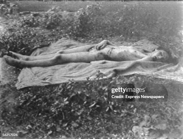 The naked corpse of Helga Goebbels , oldest child of German Nazi Propaganda Minister Joseph Goebbels, lies on a blanket in a field after Russian...