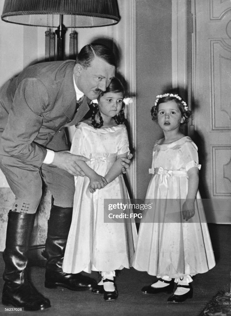 Child Hitler Genocidal German dictator and Nazi leader Adolf Hitler adjusts the ...