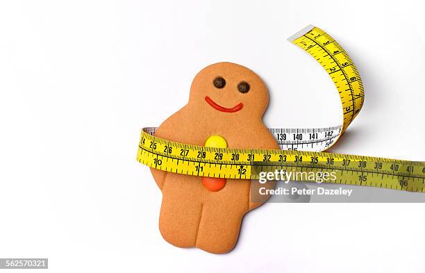 fat overweight gingerbread man - goede voornemens stockfoto's en -beelden