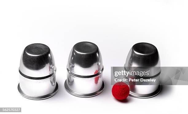 cup and balls guessing game - guessing game stock pictures, royalty-free photos & images