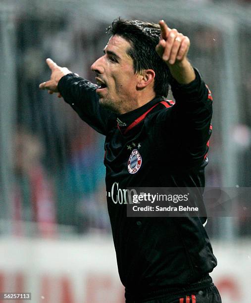 Roy Makaay of Bayern Munich celebrates after scoring the fourth goal during the UEFA Champions League group A match between Bayern Munich and Rapid...
