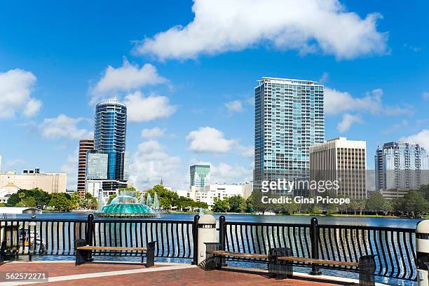 benches and railing at the lake eola orlando - orlando florida stock pictures, royalty-free photos & images