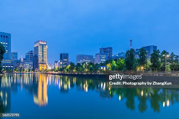 marunouchi business district at night - moat stock pictures, royalty-free photos & images