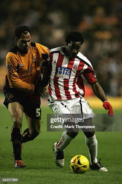 Joleon Lescott of Wolverhampton Wanderers challenges Vincent Pericard of Sheffield United during the Coca-Cola Championship match between...