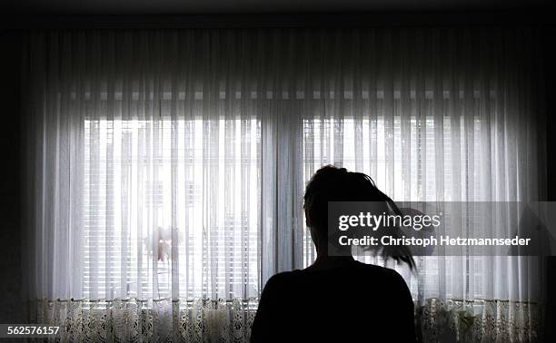 at a window - curtains blowing stock pictures, royalty-free photos & images