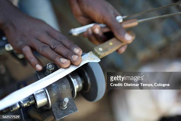 traditional knife sharpening, africa - dietmar temps stockfoto's en -beelden