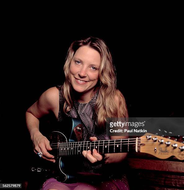 Portrait of American Blues musician Susan Tedeschi as she poses with her guitar, Chicago, Illinois, September 3, 2000.