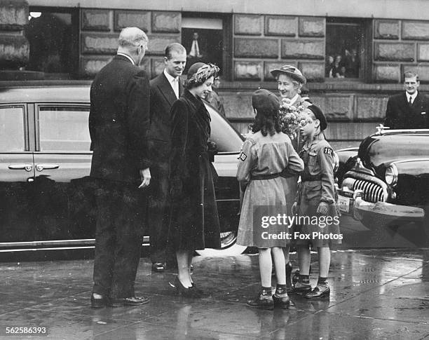 Princess Elizabeth and Prince Philip, the Duke of Edinburgh, talking to a group of Girl Scouts outside the Library of Congress, Washington DC,...