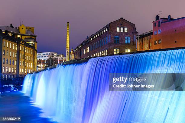 illuminated cotton mill waterfall - norrkoping imagens e fotografias de stock