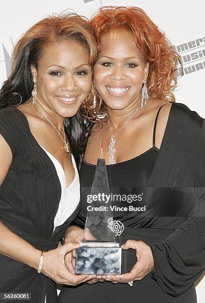 Musicians Tina Campbell and Erica Campbell of Mary Mary pose with their award for Contemporary Inspirational Artist in the press room at the 2005...