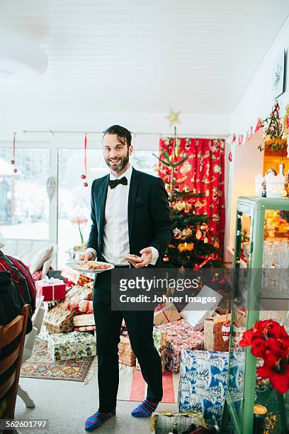 smiling man at christmas dinner - johner christmas bildbanksfoton och bilder