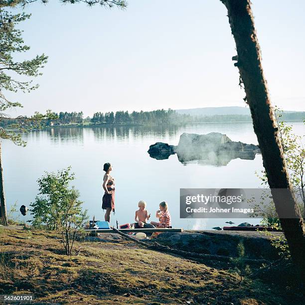 mother with children at water - dalarna bildbanksfoton och bilder