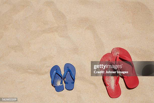 flip flops on sand - thong stock pictures, royalty-free photos & images