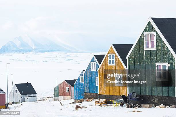 buildings in remote landscape - qaanaaq stock pictures, royalty-free photos & images