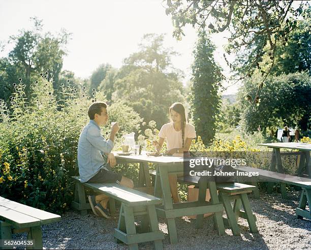 young couple at cafe - stockholm park stock pictures, royalty-free photos & images