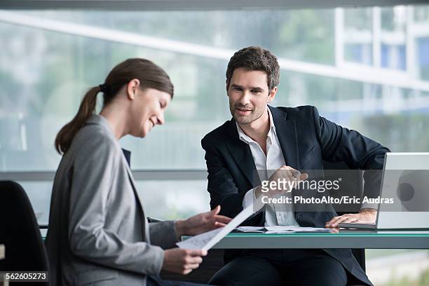 financial advisor meeting with satisfied investor - business man sitting banking imagens e fotografias de stock