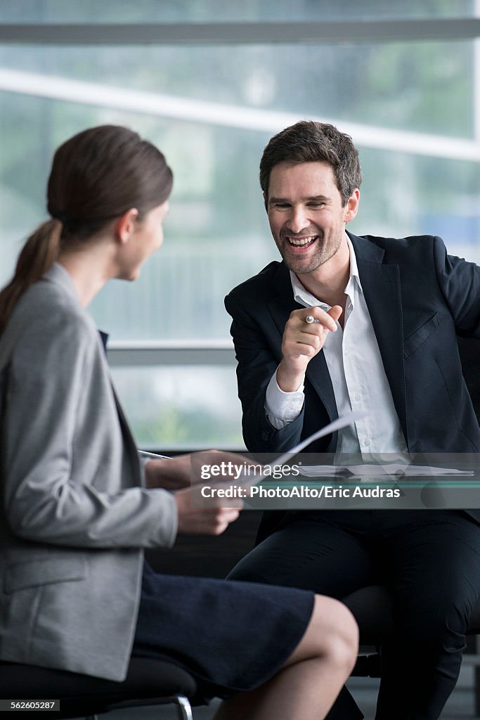 Businessman man having lighthearted meeting with client