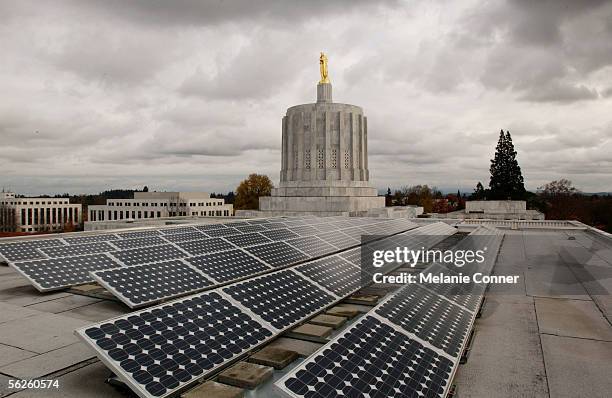 Photovoltaic solar panels are mounted on the west wing roof of the Oregon State Capitol November 14, 2005 in Salem, Oregon. The 60 panels cover 850...