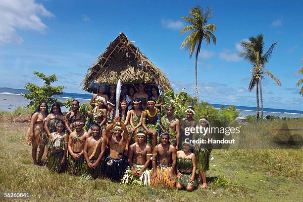 Nauruans dress in traditional Pacific island costumes to welcome the Melbourne 2006 Queen's Baton during the Nauru leg of the baton's journey...