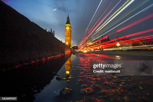 light trails across westminster bridge with big ben in the background, london, uk - house of lords stock-fotos und bilder
