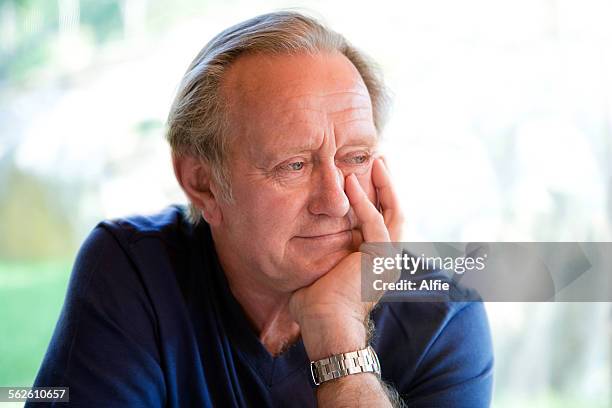 portrait of a senior man smiling - alfie oldman stock-fotos und bilder