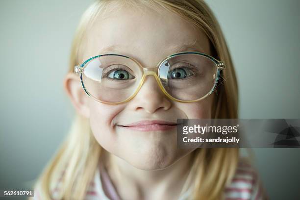 girl wearing glasses making a silly face - kind brille stock-fotos und bilder