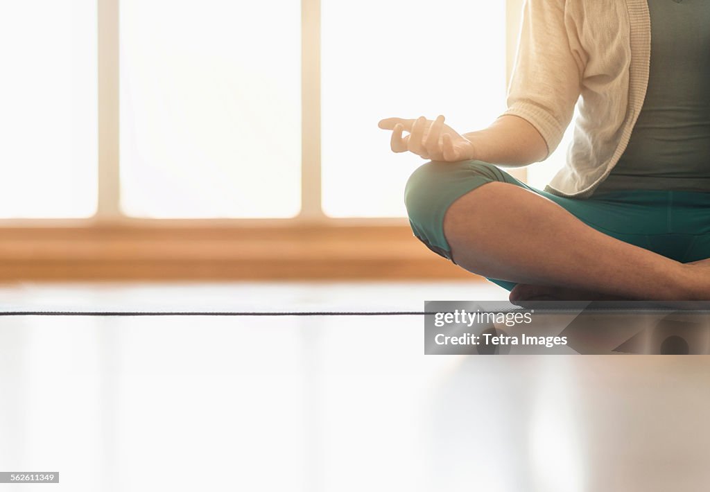 Woman meditating on floor