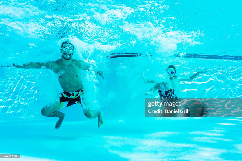 USA, Florida, Jupiter, Man swimming with his brother (8-9)