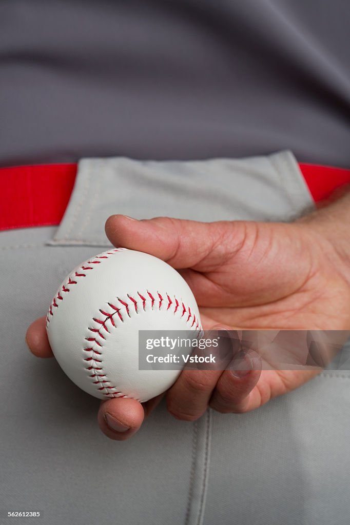 Hand of man holding baseball