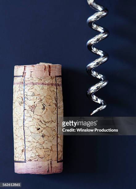 corkscrew and wine cork - wine cork stockfoto's en -beelden