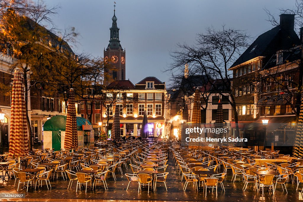 Netherlands, South Holland, Hague, Gothic St. James Church, Town square with cafe tables