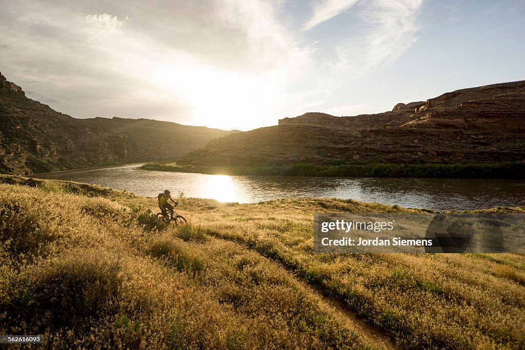 A man biking on slickrock trails.