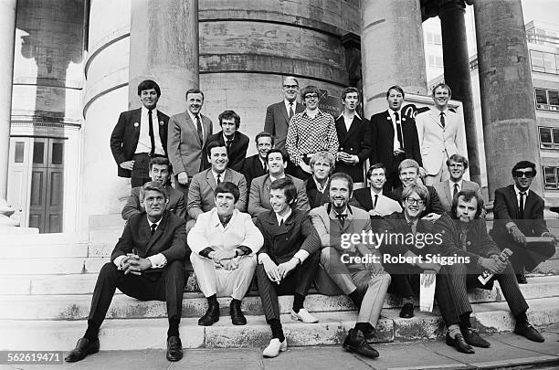 Radio One DJ's pose for a group photograph outside Broadcasting House after the BBC announce their new line up, London, 1967. Back row ; Tony...