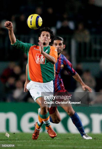 Nelson Valdez of Werder Bremen is chased by Thiago Motta of Barcelona during the UEFA Champions League Group C match between FC Barcelona and Werder...