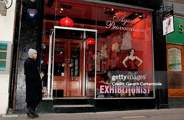 Models wearing underwear by luxury lingerie brand Agent Provocateur perform in a live window display to marks tomorrow's publication of new book...