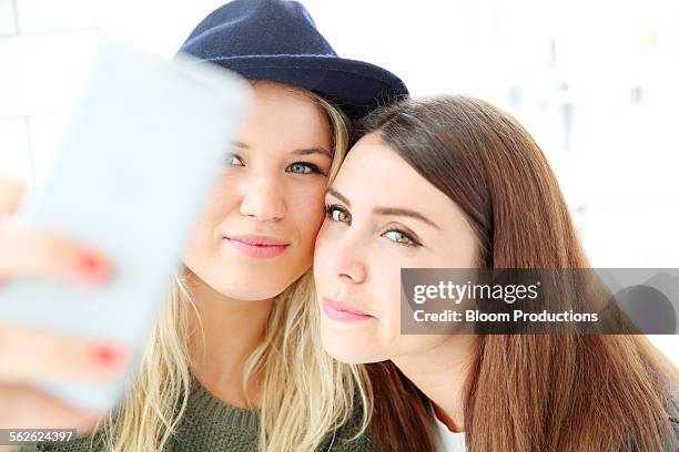 two girlfriends taking a selfie picture - hazel bond stock pictures, royalty-free photos & images