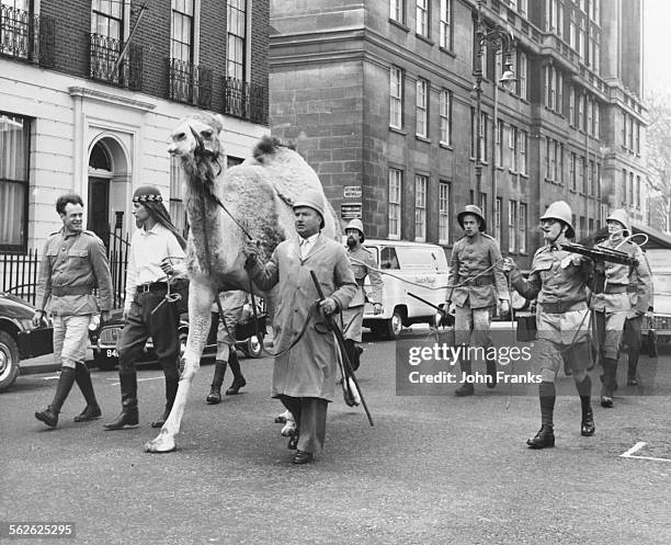 Group of recording artists known as the 'Temperence Seven' arriving with their camel at EMI offices in Manchester Square, London, March 19th 1962.