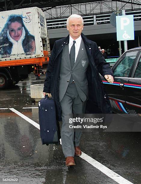Coach Giovanni Trapattoni of Stuttgart walks to the team bus after VfB Stuttgart arrive at Makedonia airport on November 23, 2005 in Thessalonika,...