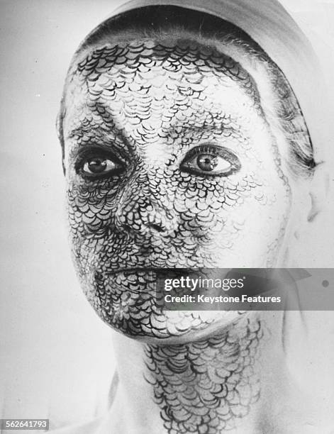 Portrait of model Veruschka, or Vera von Lehndorff, with her face painted with scales for the film 'Stop Veruschka' by Franco Rubartelli, circa 1965.