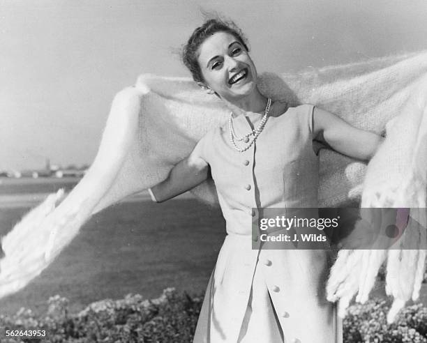 Portrait of French dancer Violette Verdy smiling as she lands in the country to appear in the musical 'The Princess' at the Strand Theatre, at London...