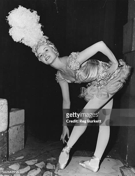 Portrait of French dancer Violette Verdy wearing a showgirl costume and large headdress, during rehearsals for the television show 'Music For You' at...