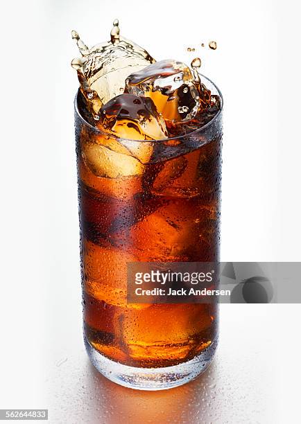 glass of soda with splash - cola stock pictures, royalty-free photos & images