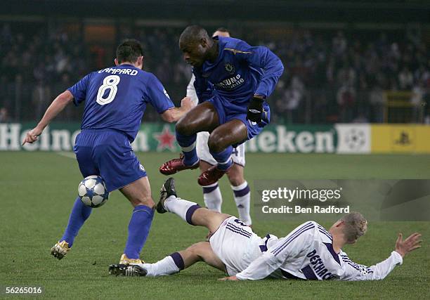 Frank Lampard and William Gallas of Chelsea battle with Olivier Deschacht of Anderlecht during the UEFA Champions League match between Anderlecht and...